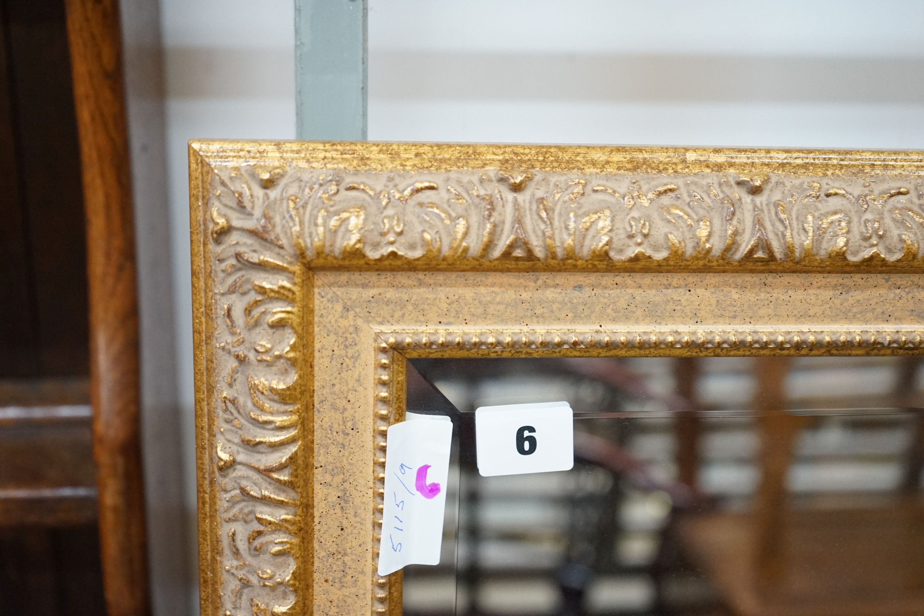 A reproduction gilt framed wall mirror, width 103cm, height 135cm